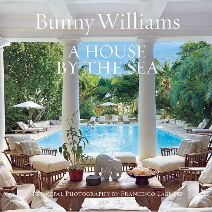 Hardcover book cover featuring a tropical pool patio with white columns, rattan lounge chairs, and a wooden coffee table.