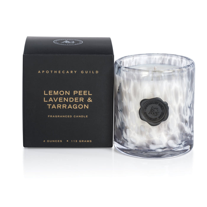 Apothecary Guild 4oz scented candle in a speckled opal glass jar with a black wax seal next to its matching black box.