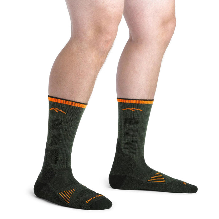 Darn Tough lightweight olive green merino wool hunting socks with orange trim and breathable mesh panels.
