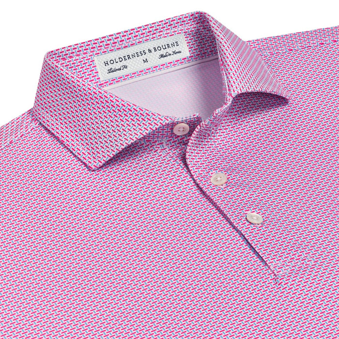 Holderness & Bourne Davis polo in pink and blue geometric print with a spread collar and trocas shell buttons.