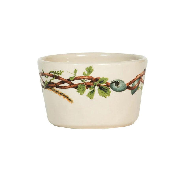 Cream-colored stoneware ramekin featuring a decorative forest floor motif with vines, leaves, and berries.