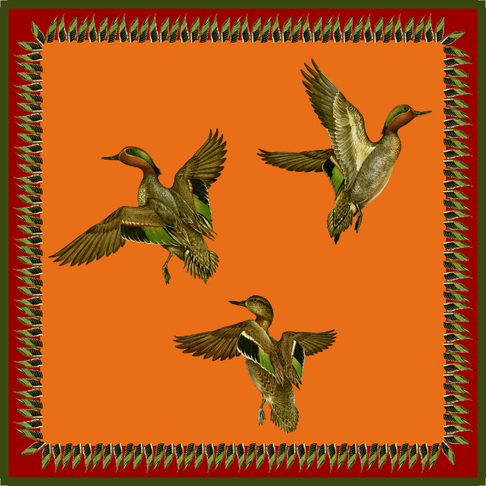 Orange Italian-crafted bandana featuring flying mallard ducks and a decorative green leaf border, 25-inch square.