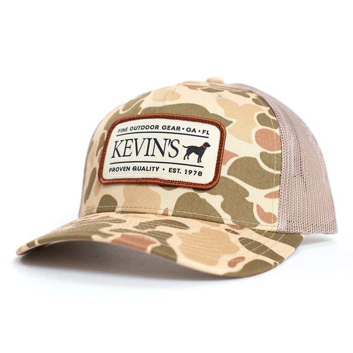 Kevin's Richardson camo trucker cap with a 5-panel design, tan mesh back, and a branded patch on the front.