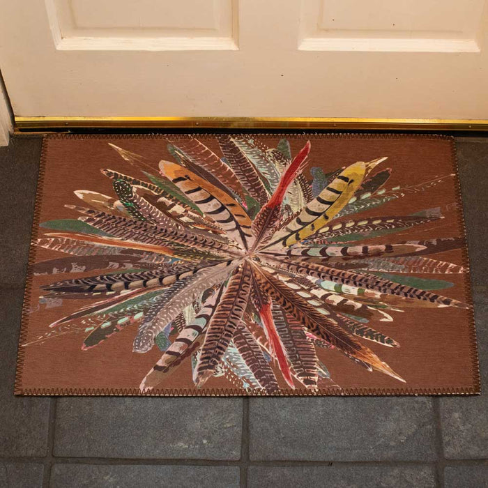 Brown chenille door mat featuring a vibrant, starburst pheasant feather pattern in a 20x30 inch low-profile design.