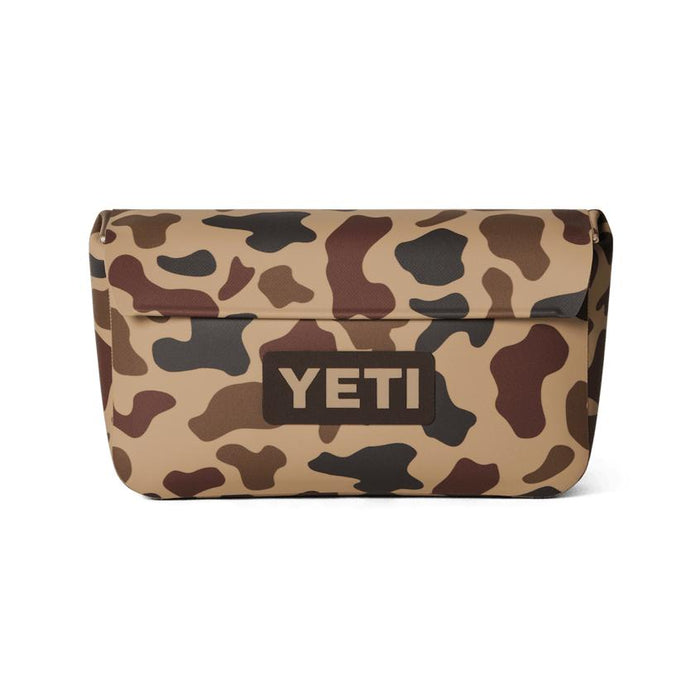 YETI Sidekick Dry 1L gear case in tan camo print with a durable, waterproof magnetic closure and front logo patch.