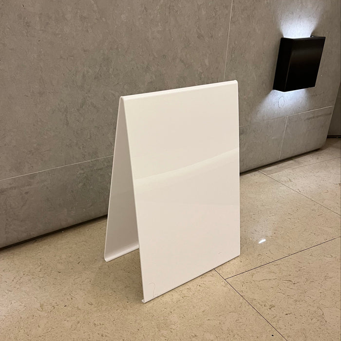 Left angled view of a blank white opaque acrylic A-frame sign.
