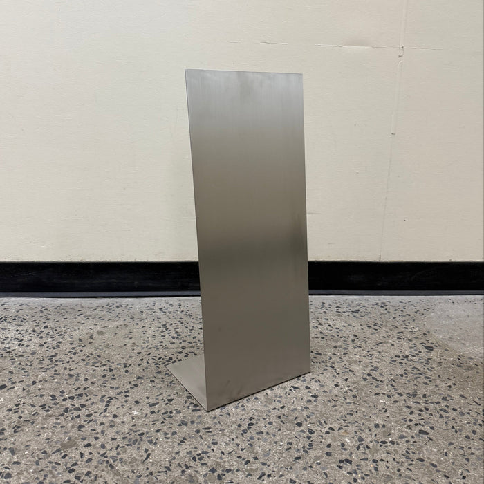 Front view of a blank slanted stainless steel floor sign.