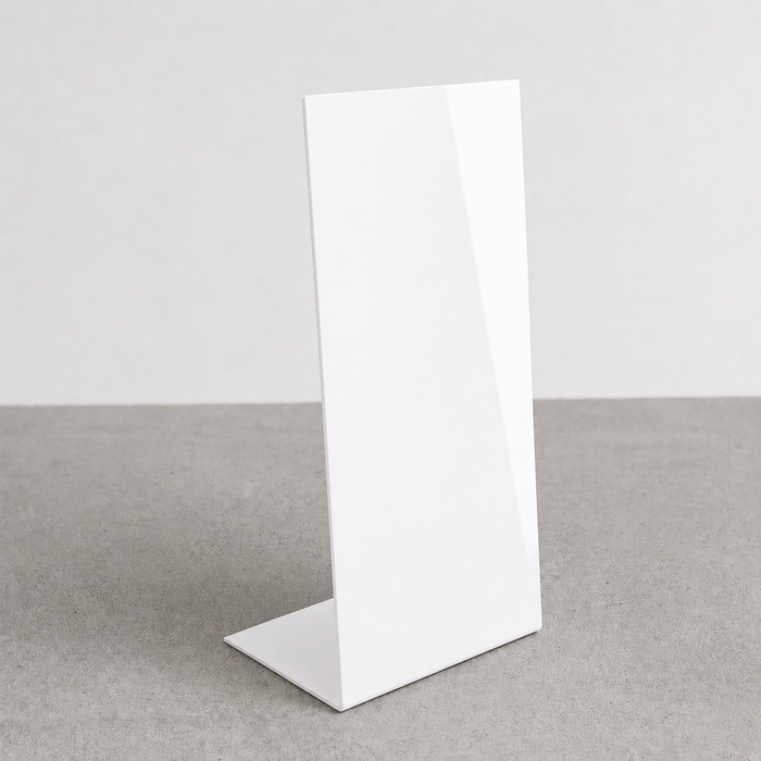 White opaque acrylic floor sign with a slanted face and flat bent base.