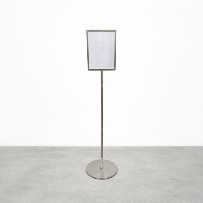 Stainless steel pole sign with a rectangular menu frame and round base.