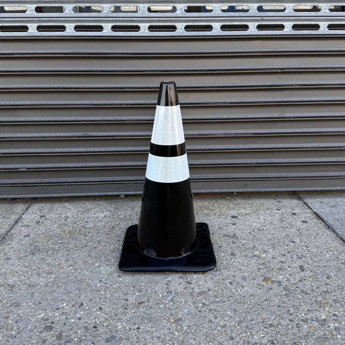 Front view of a black traffic cone with two reflective bands.