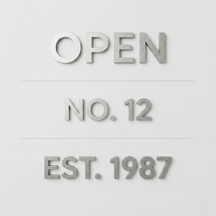 Dimensional aluminum lettering samples reading Open, No. 12, and Est. 1987.