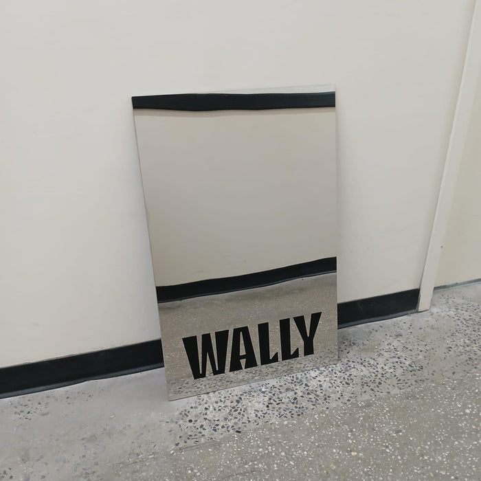 Mirrored leaning panel sign with black Wally lettering.
