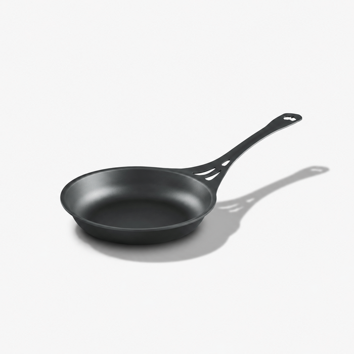 Solidteknics AUS-ION 24cm wrought iron frypan with long vented handle on a light grey background