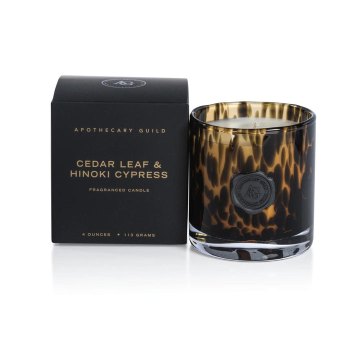 Apothecary Guild Cedar Leaf & Hinoki Cypress candle in a tortoise shell glass jar with a black wax seal and matching box.
