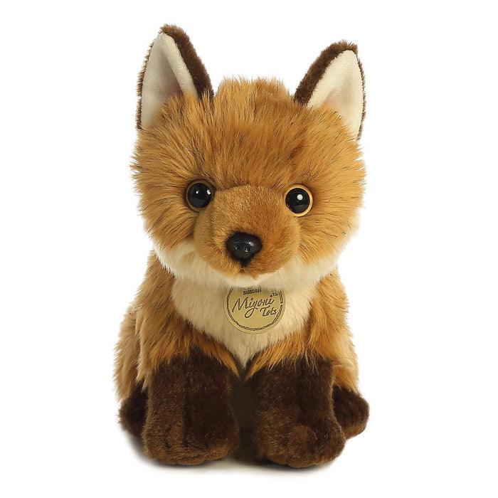 9-inch Aurora Miyoni plush fox with soft brown fur, dark paws, and a gold branded hang tag on a white background.