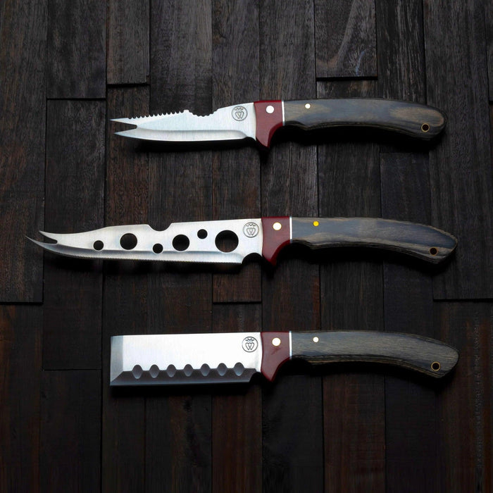 Prince of Scots charcuterie knife set with stainless steel blades and dark wood handles on a rustic wooden background.