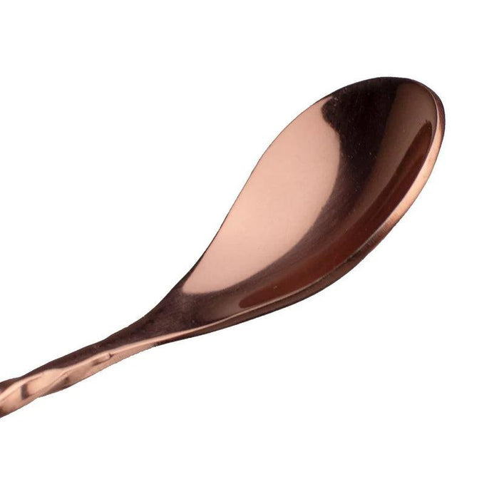 Copper-plated stainless steel bar spoon with a concave bowl and twisted handle for professional cocktail stirring.