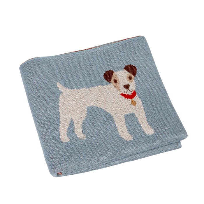 Folded blue cotton knit baby blanket featuring a cute white dog with a red collar and brown ears.