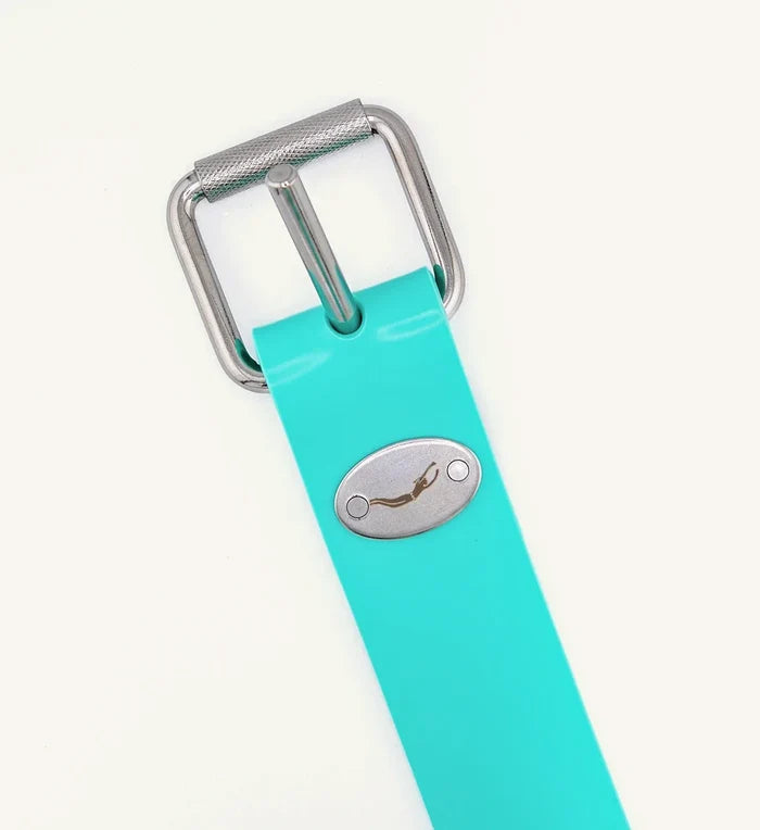 Close-up of a turquoise rubber weight belt featuring a stainless steel roller buckle and an oval Waihana diver logo badge on a white background.