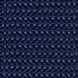 Close-up of durable dark navy blue fabric with a tight, textured weave pattern for custom pant facing.