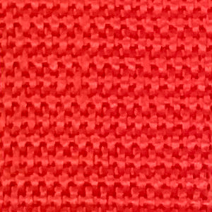 Close-up of vibrant red briar-resistant fabric with a durable, textured weave pattern for pant facing.