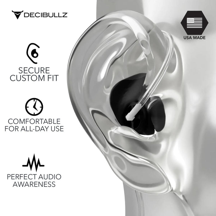 Black Decibullz custom-moldable surveillance earpiece with a clear acoustic tube adapter worn in a mannequin ear.