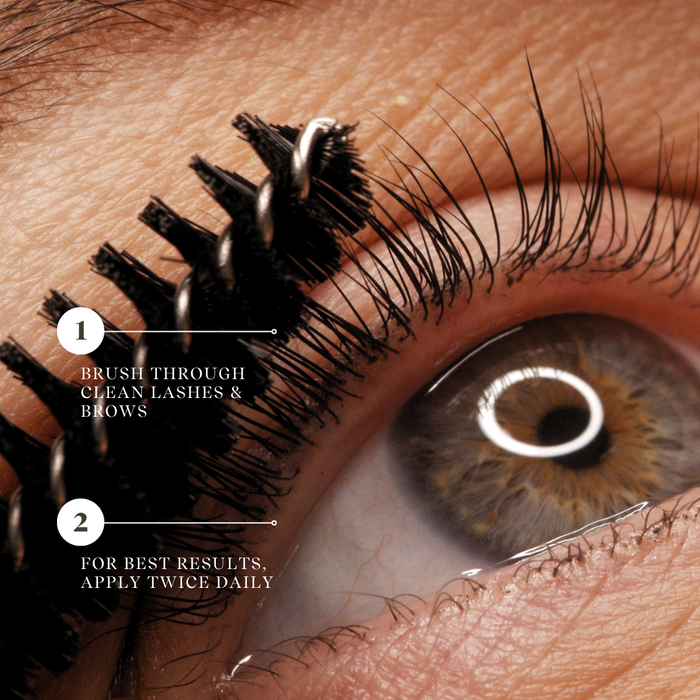 A bottle of Conditioning Lash & Brow Serum with a brush applicator. Supports tihicker, stronger lashes. Plant based oils