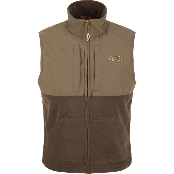 Drake MST Eqwader vest in brown featuring a waterproof upper, fleece lower body, and dual chest pockets.