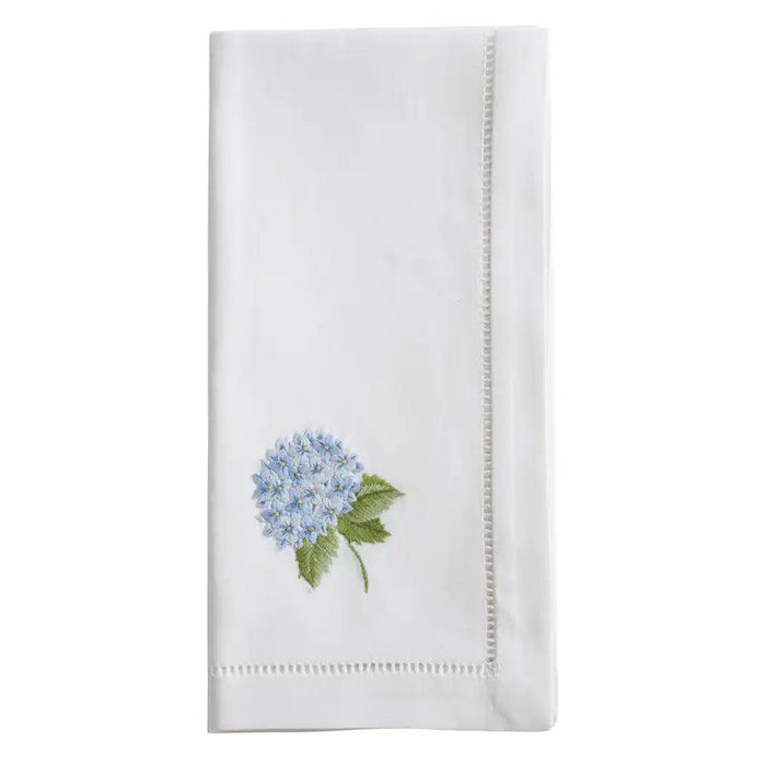 White 20-inch cotton napkin with delicate blue hydrangea embroidery and elegant hemstitch border detail.
