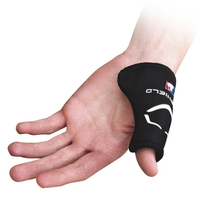 A hand wears the EvoShield Catcher's Thumb Guard: WTV4000BL, a black brace from EvoShield with white text and logo, designed to provide compression and protect catchers’ thumbs to help prevent injuries.