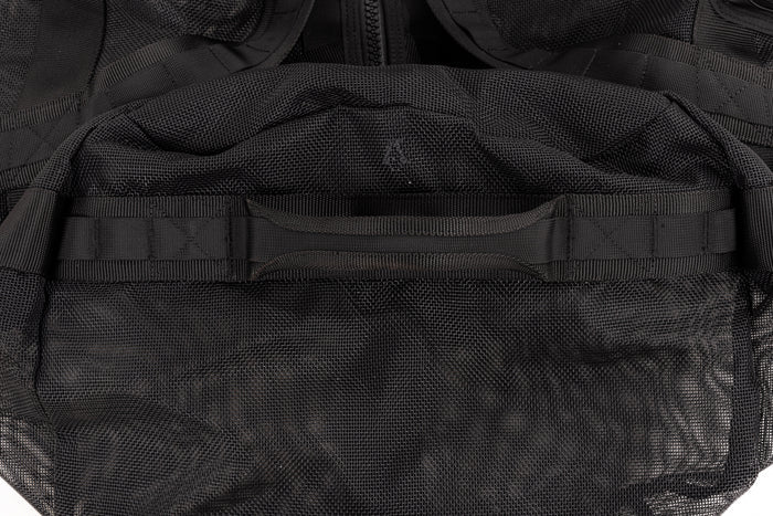 Close-up of the reinforced top carry handle and textured mesh fabric on the Waihana Expedition Duffel bag in black.