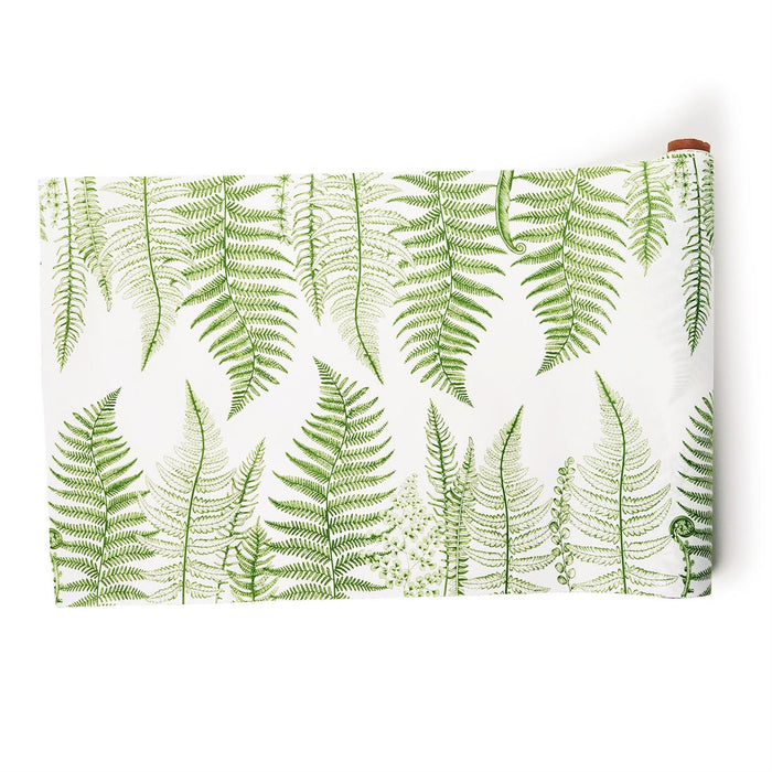 White paper table runner featuring a detailed green botanical fern pattern on a 25-foot roll for elegant table settings.