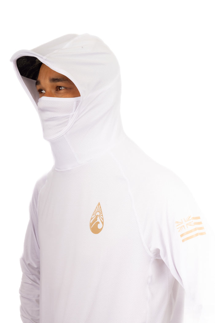 Male model wearing a white Waihana Ghost Sun Shirt with built-in balaclava-style hood and face mask, featuring a gold Waihana drop logo on the chest and Hawaiian flag sleeve graphic.