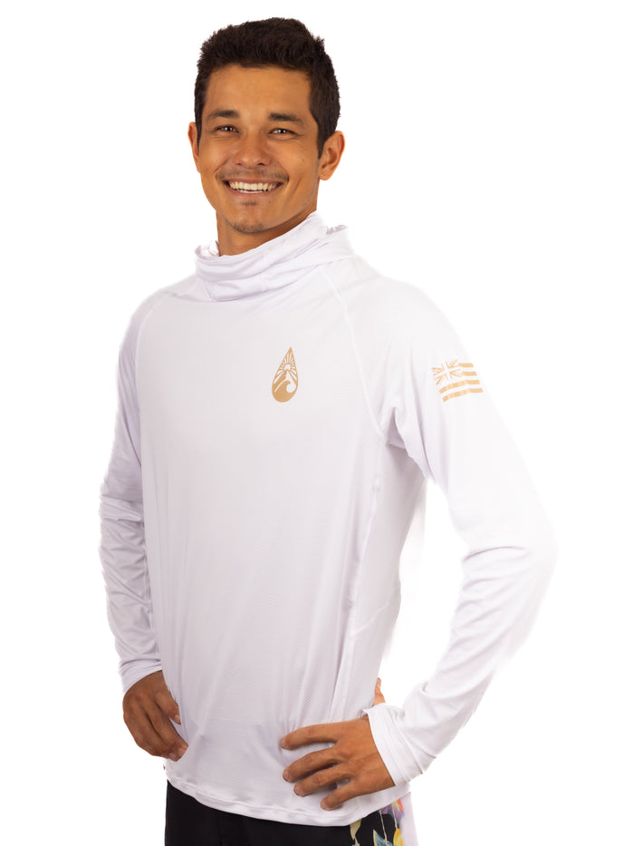 Smiling man wearing the Waihana Ghost Sun Shirt in white, a long-sleeve hooded UPF rashguard with gold brand logo on chest and Hawaiian flag sleeve detail, shown against a clean white background.