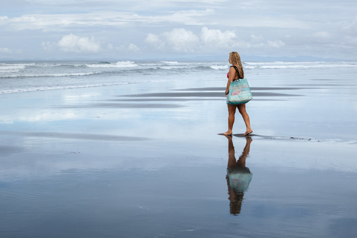 Emilia holding the Gili Gear Tote Bag, highlighting roomy capacity for watersports gear