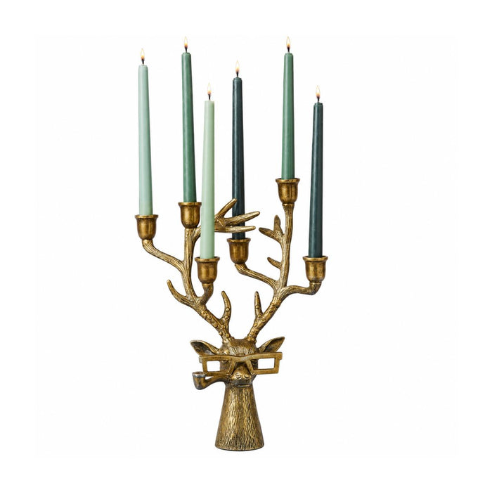 Gold cast aluminum buck candelabra with glasses, holding six taper candles in its antlers.
