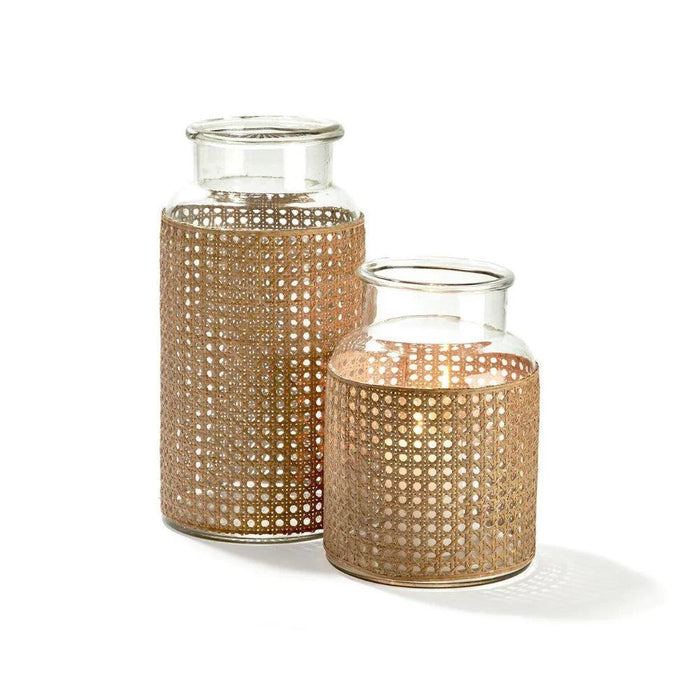 Two clear glass jars wrapped in natural woven cane webbing in small and large sizes on a white background.