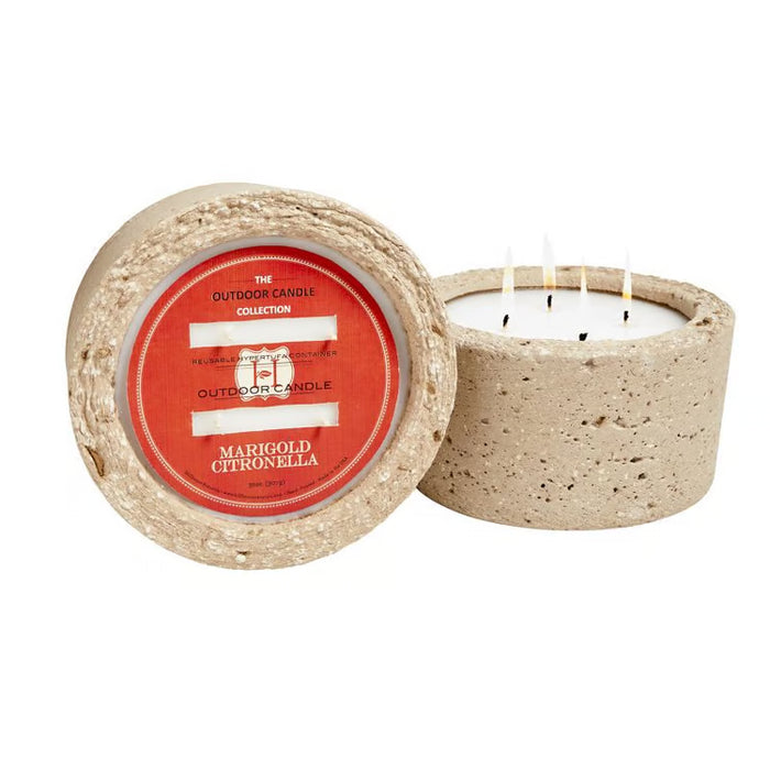 Hillhouse Naturals 32 oz marigold and cedarwood outdoor candle in a textured, round beige hypertufa stone container.