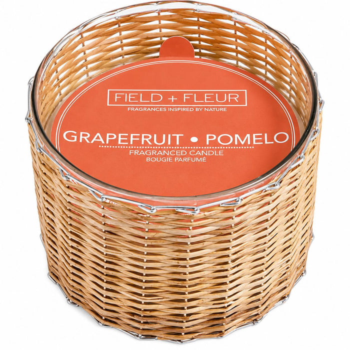 Hillhouse Naturals 21 oz 3-wick candle in a handwoven rattan basket with a Grapefruit Pomelo label.