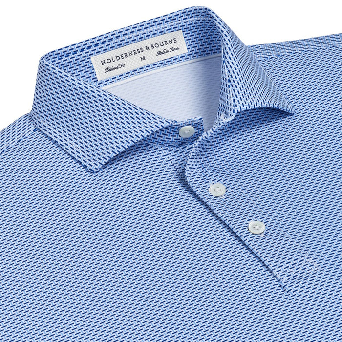 Holderness & Bourne Davis polo in blue geometric print with spread collar, shell buttons, and tailored fit.