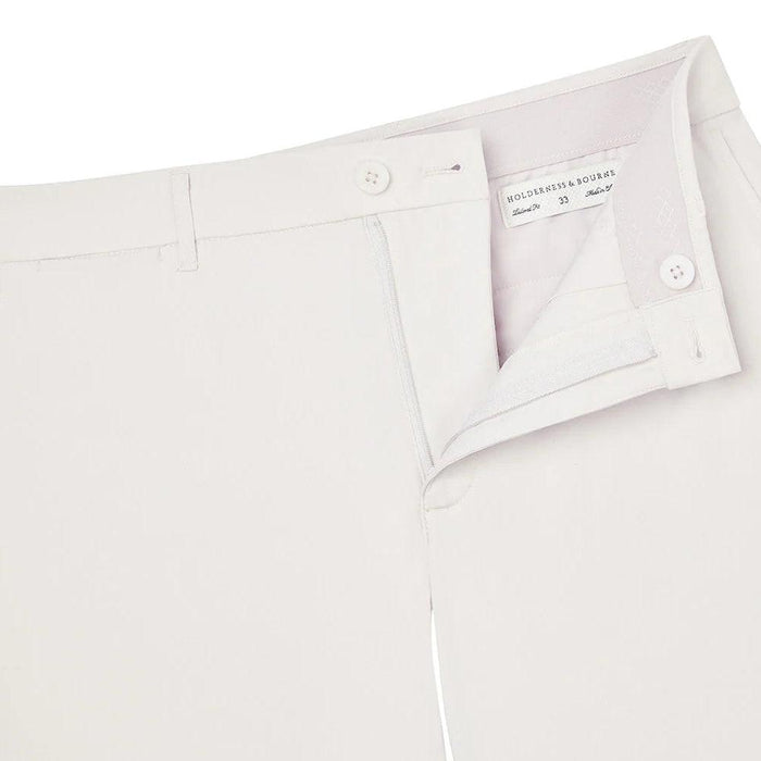 Light grey Holderness & Bourne Harwood performance golf shorts with a non-slip waistband and size 33 interior label.