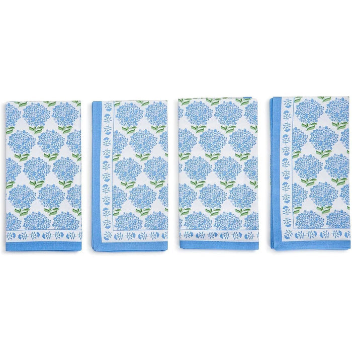 Set of four blue and white cotton napkins featuring a classic floral hydrangea print and a decorative border.