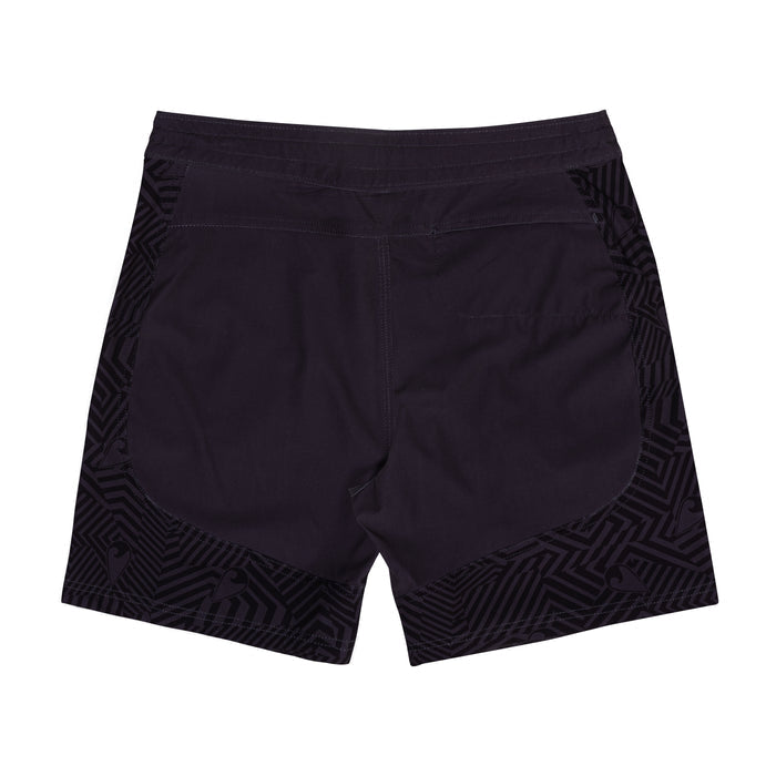 Rear view of Waihana Jet Black W1-PRO board shorts with tonal geometric pattern panels on the sides and hem against a solid dark center, displayed on a white background.