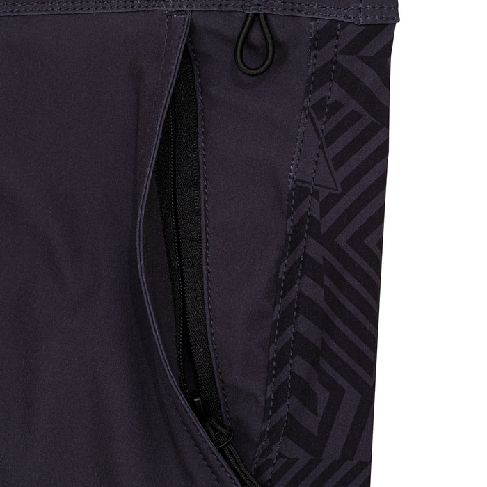 Close-up of the zippered security pocket and tonal geometric print panel on the Waihana Jet Black W1-PRO board shorts.