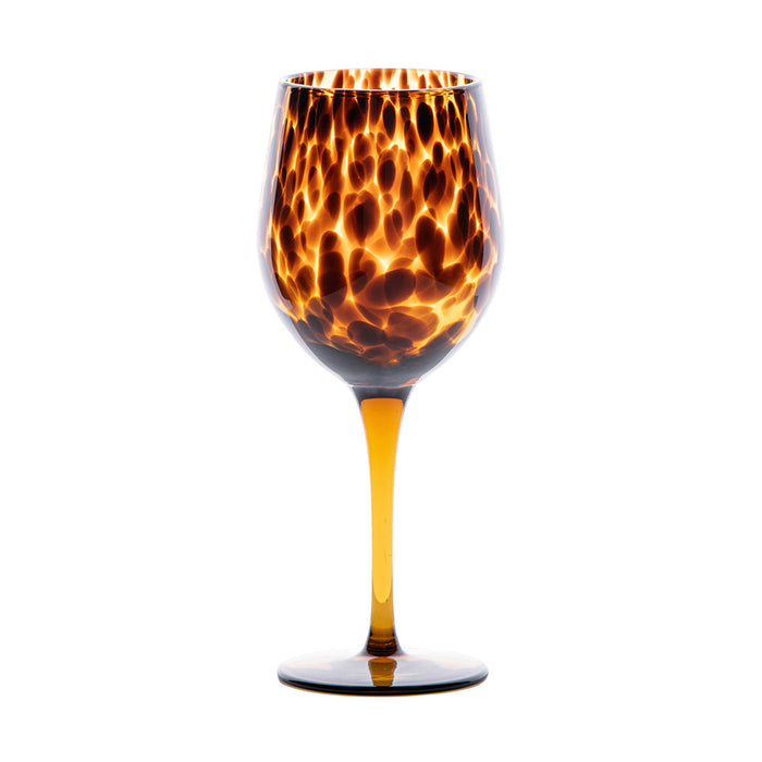 Juliska Puro wine glass featuring a translucent brown tortoiseshell pattern with dark specks and an elegant 8.5-inch silhouette.