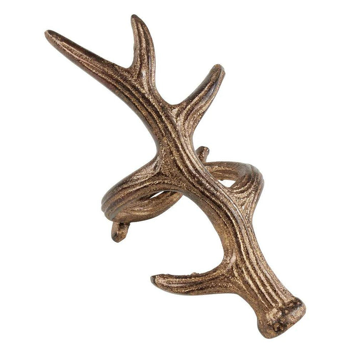 Rustic bronze-toned antler napkin ring with detailed, textured finish for lodge-style table decor.