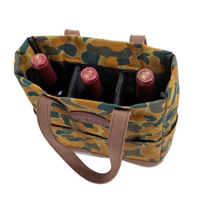 Camo canvas wine tote with brown handles holding three wine bottles in a padded, divided interior.