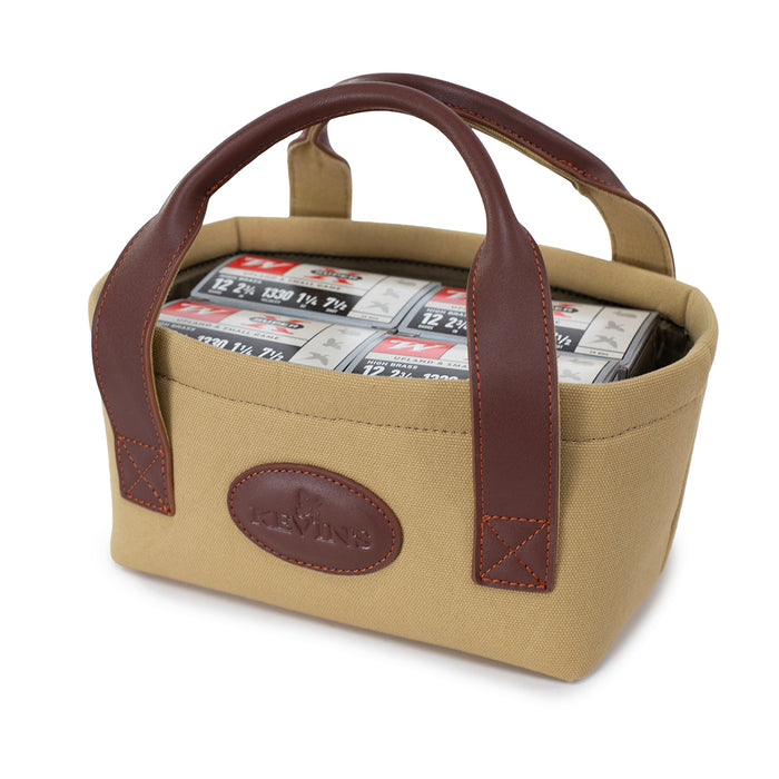 Tan canvas and brown leather shell carrier with Kevin's logo, holding boxes of 12-gauge shotgun shells.