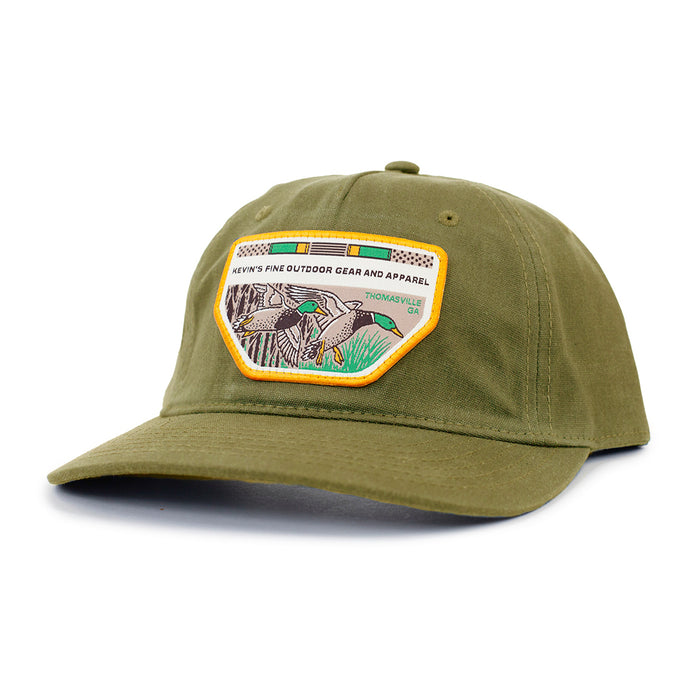 Olive green waxed cotton cap featuring a Casey Underwood mallard duck patch and a pre-curved visor.