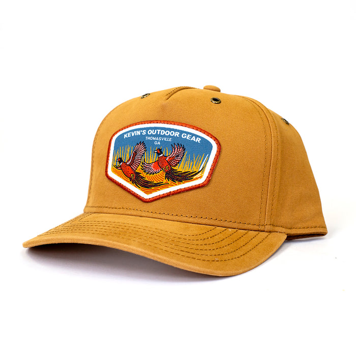 Tan brushed canvas five-panel cap featuring a Kevin's Outdoor Gear pheasant patch and durable stitched brim.